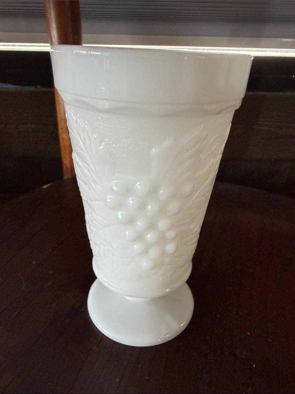 White milk, glass vintage goblet. Ceramic Pedestal Vase with Grape Relief